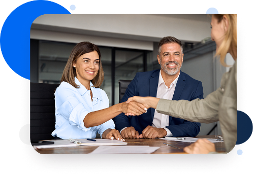 partners shakng hands smiling